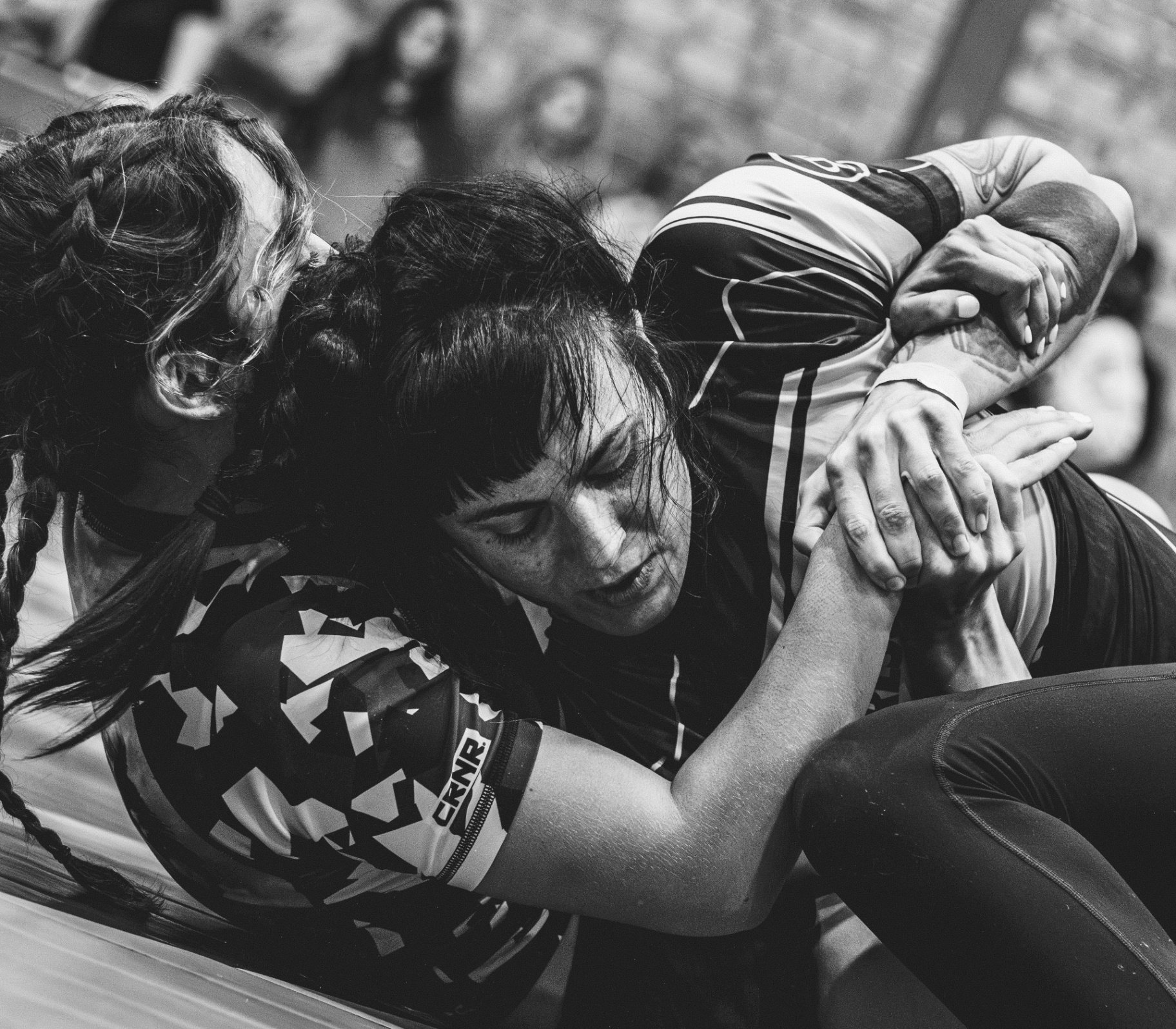 Women competing in submission grappling